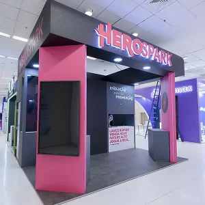 The Herospark Company stand being assembled. It has a black and pink colours.