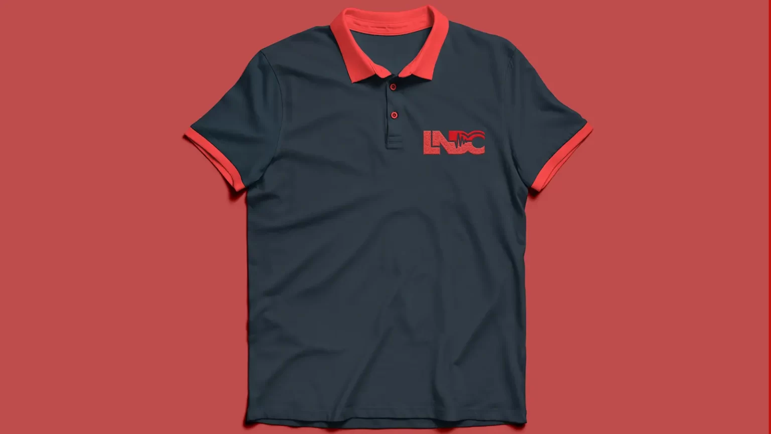 A dark blue tshirt and red finishings and LNDC logo