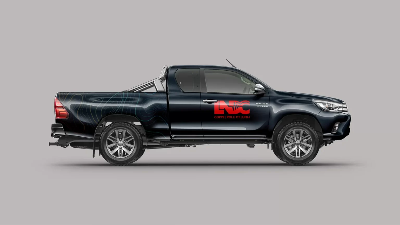 A pickup truck in dark blue with LNDC red logo and curved lines in heatmap gradient (from red to strong green)