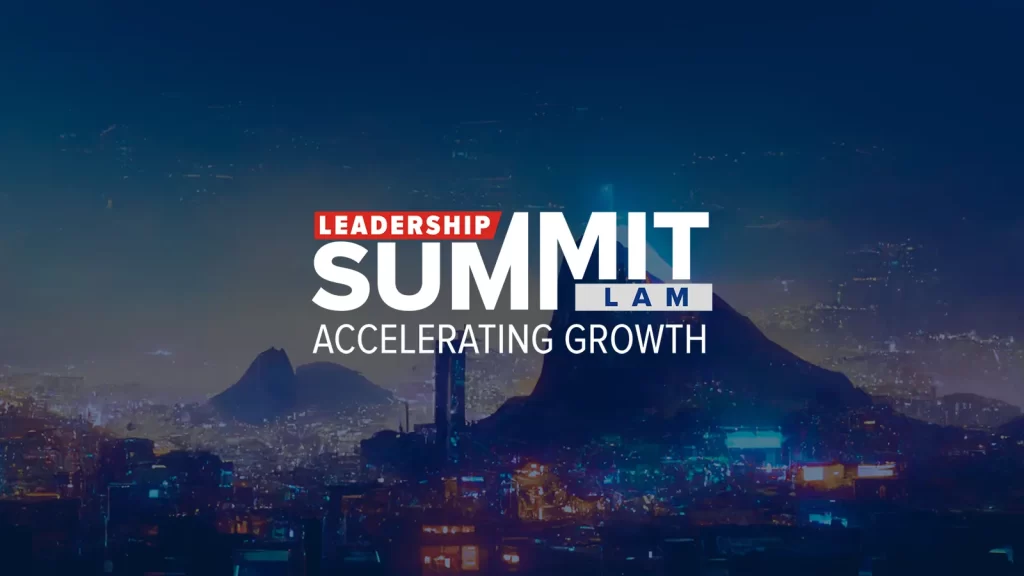 A futuristic illustration of Sugarloaf at night in Rio de Janeiro, with lots of night lights. The image has a blue filter and a logo for an event which says: Leadership Summit LAM Accelerating Growth